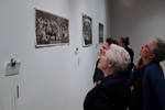 Former Jewish residents of Cape Breton Island joined by Dr Marcia Ostashewski look at photos from the Chernin archive during the Jewish Life on Cape Breton Island Exhibit at York university in May 2014.