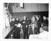 Photograph of a blessing during the silver jubilee of Father Zarsky's ordination. 