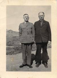 Father Zarsky posing with man in uniform. 