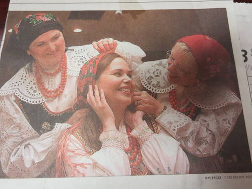 A photograph of three women from St. Mary"s Polish Church wearing traditional dance costumes.